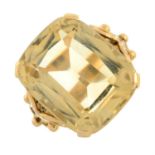 A citrine single-stone dress ring, with raised band decoration.