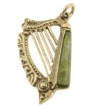 A harp charm, with green marble detail.