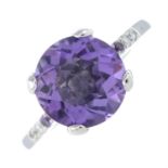 An 18ct gold amethyst and colourless gem dress ring.