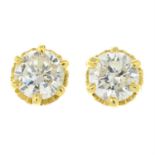 A pair of brilliant-cut diamond stud earrings.