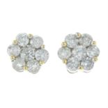 A pair of diamond cluster earrings.