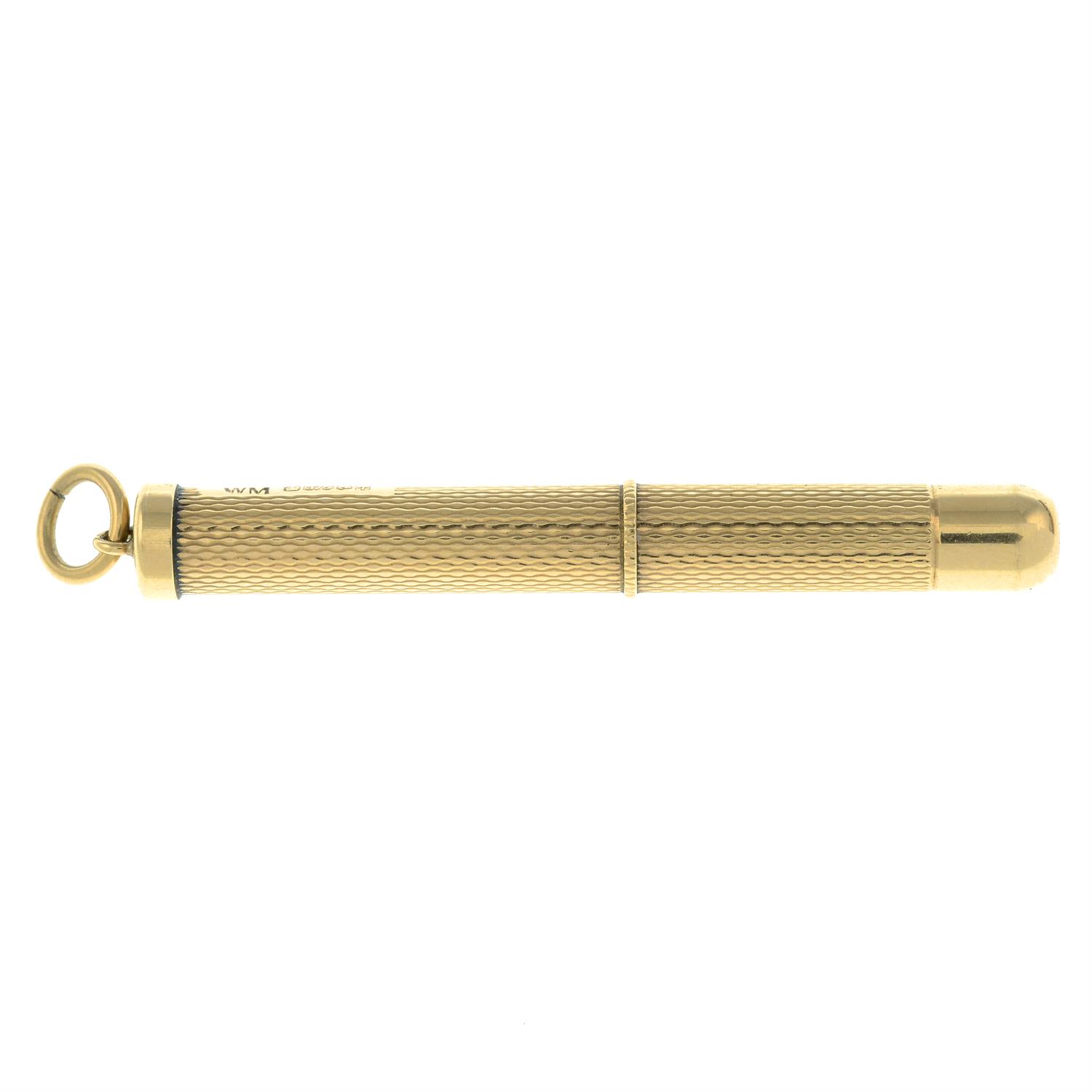 A 9ct gold retractable toothpick.