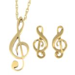 A set of 9ct gold jewellery, each depicting a treble clef, comprising a pendant with chain and a