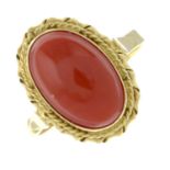 A coral single-stone ring.
