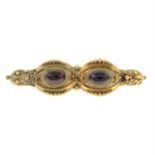 A Victorian garnet brooch.