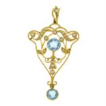 An early 20th century 15ct gold aquamarine and split pearl pendant.