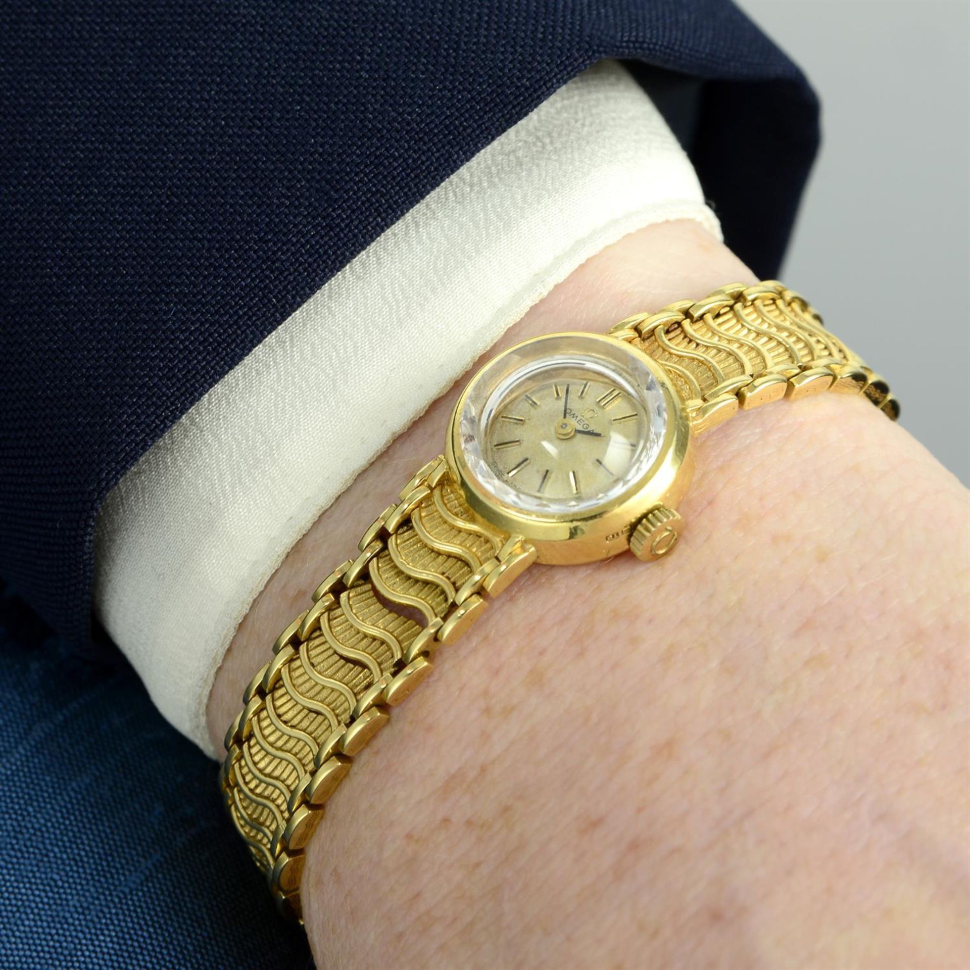 OMEGA - an 18ct yellow gold bracelet watch, 17mm. - Image 5 of 5