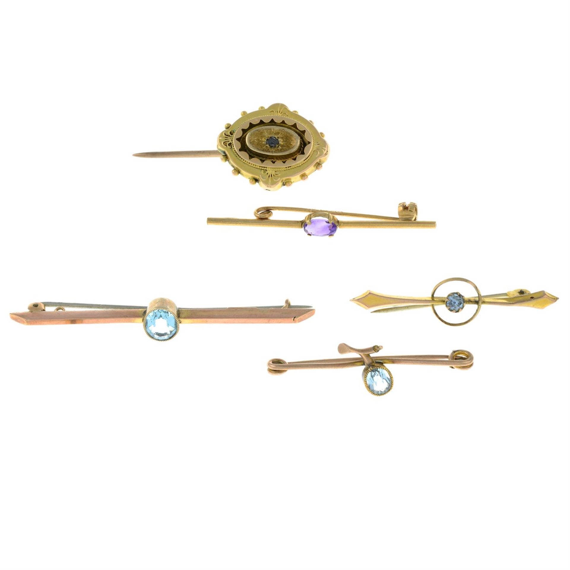 A small selection of four Victorian and later 9ct gold gem-set brooches and a gem-set stickpin.