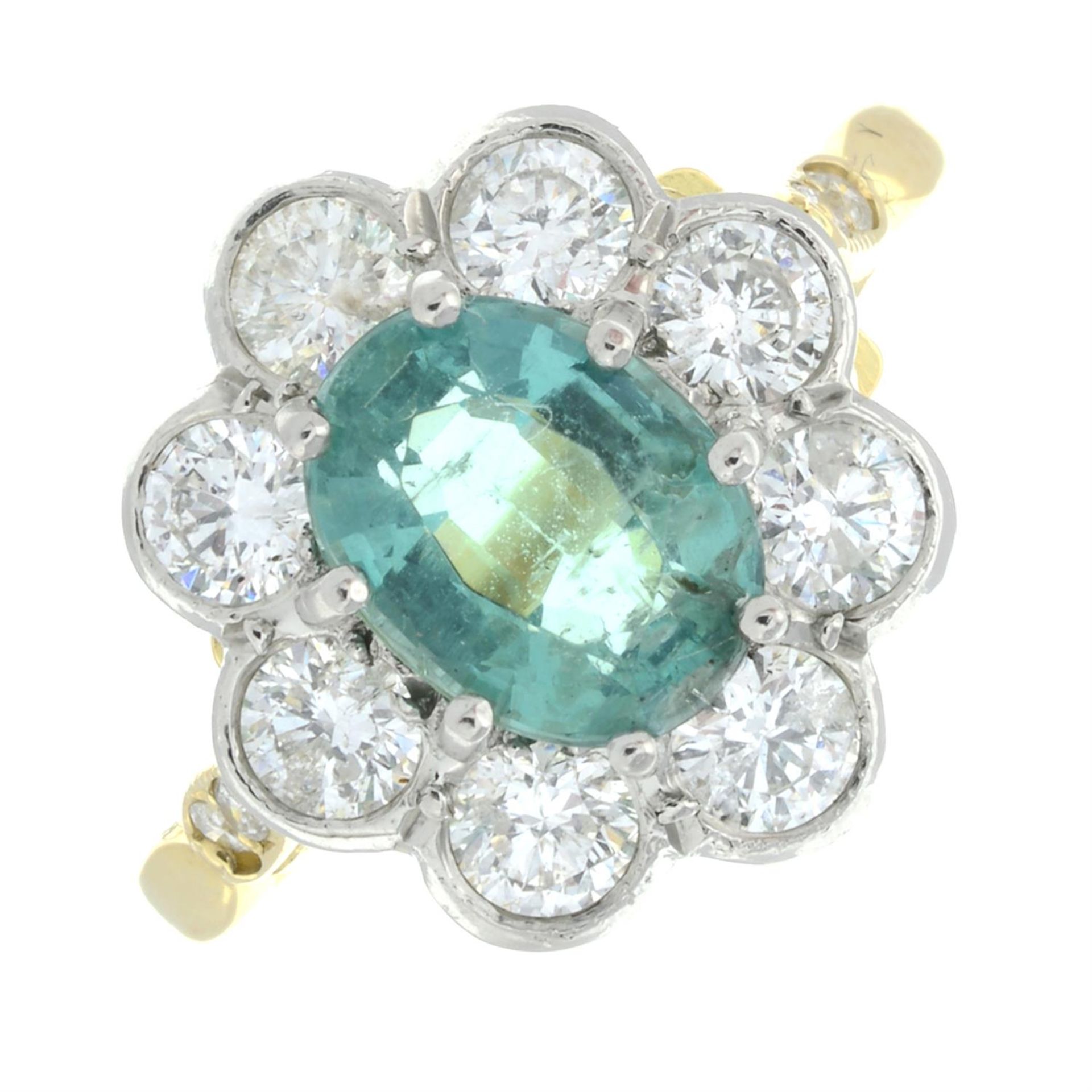 An emerald and brilliant-cut diamond cluster ring, with brilliant-cut diamond shoulders.