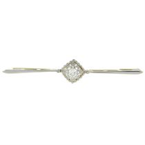 An old-cut diamond single-stone bar brooch.