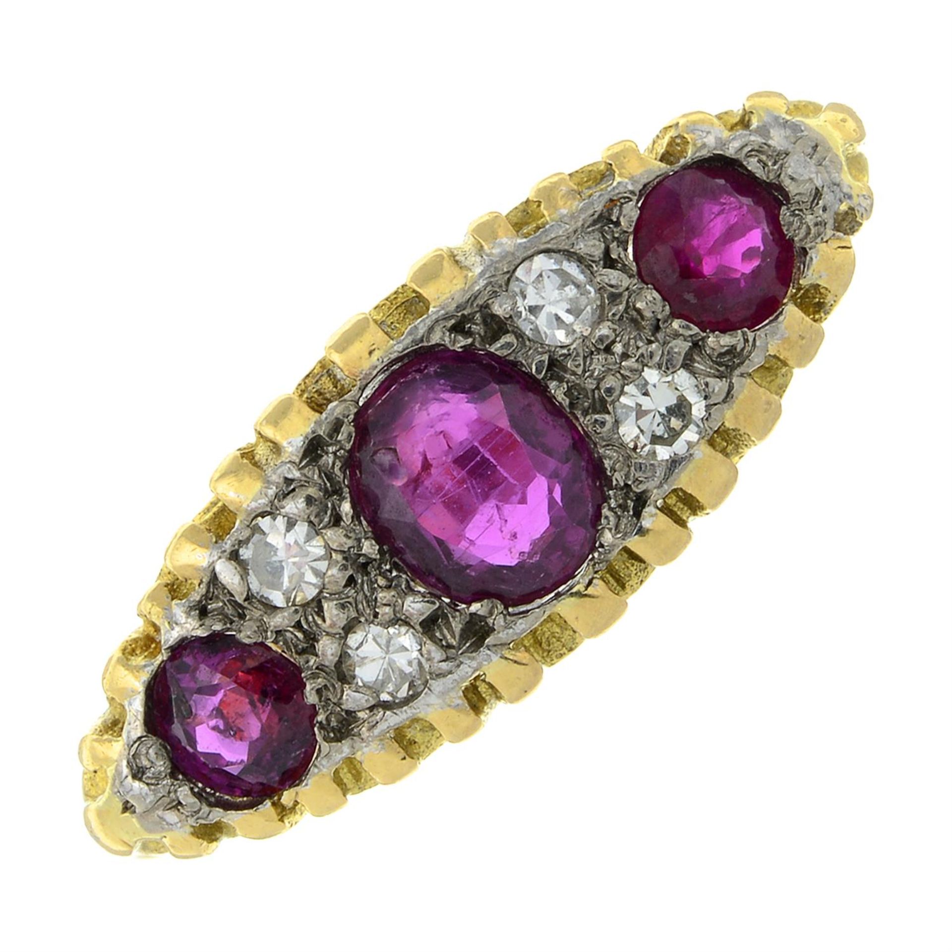 An early to mid 20th century 18ct gold ruby three-stone ring, with single-cut diamond spacers.