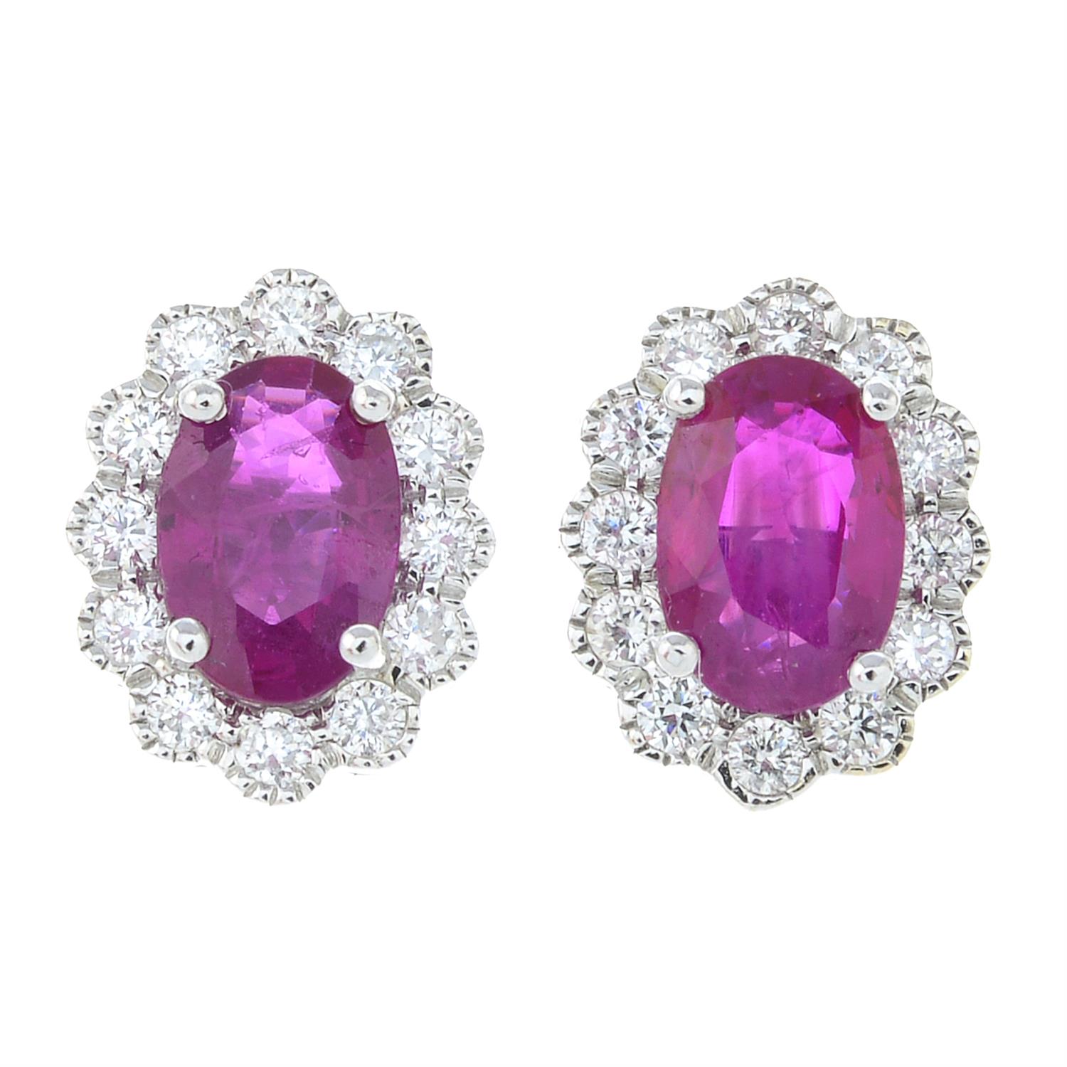 A pair of 18ct gold ruby and brilliant-cut diamond oval-shape cluster earrings.