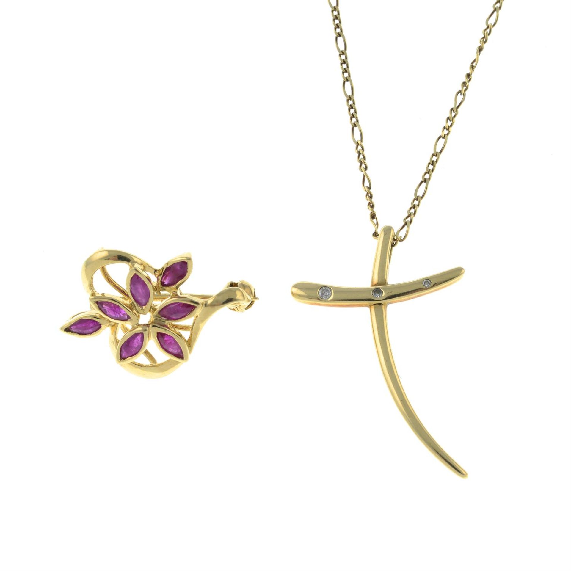 A 9ct gold ruby brooch and a 9ct gold diamond cross pendant, with chain.