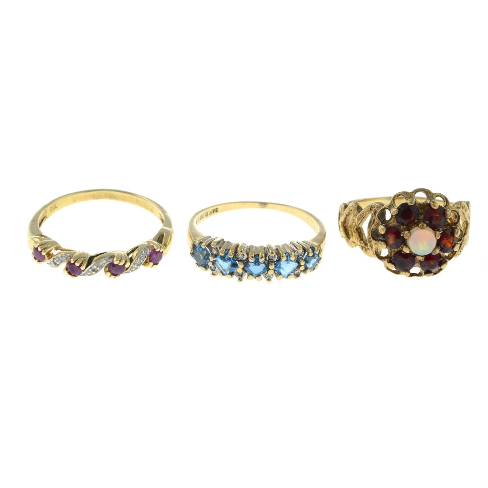 Three 9ct gold gem-set rings.