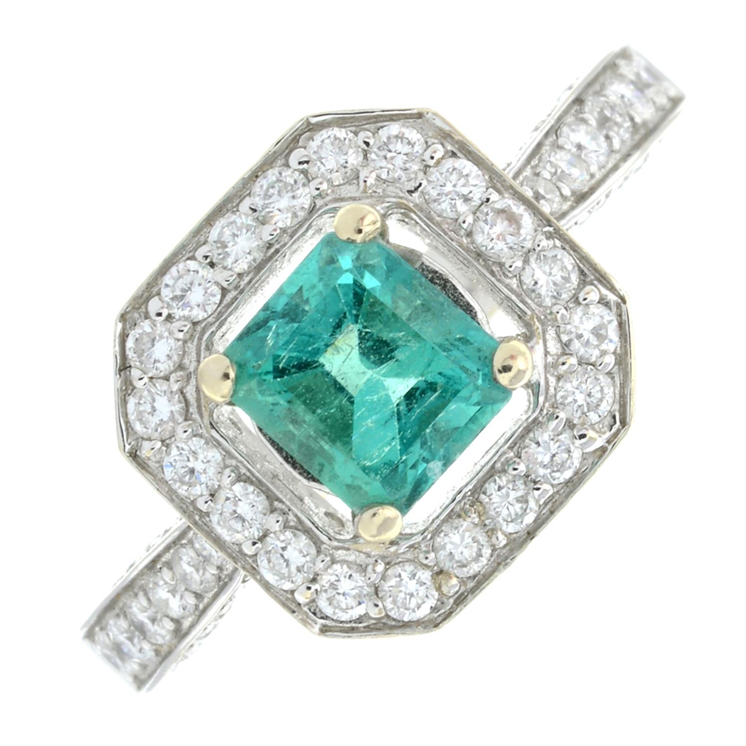 An 18ct gold emerald and brilliant-cut diamond cluster ring, with pavé-set diamond shoulders.