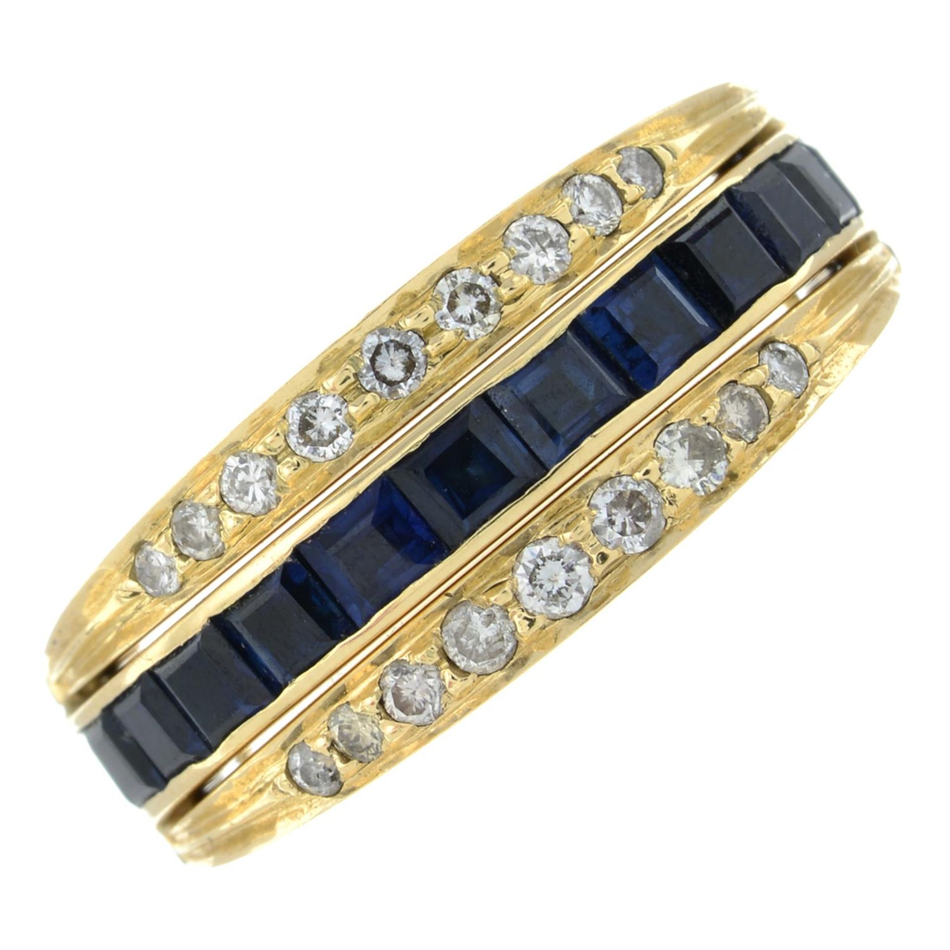 A brilliant-cut diamond, emerald and sapphire swivel ring.