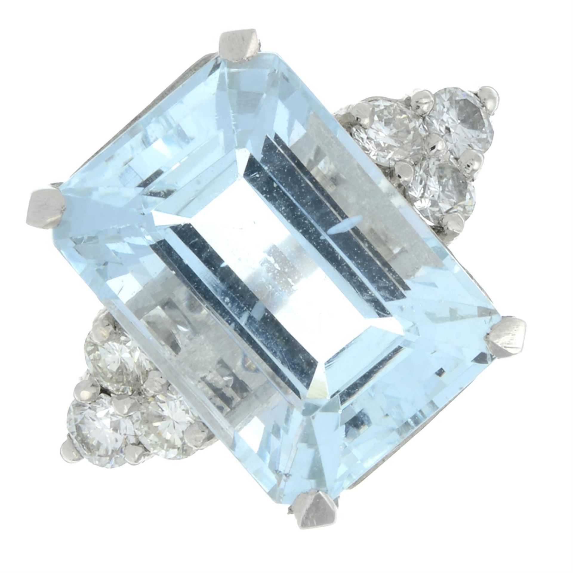 An aquamarine ring, with brilliant-cut diamond trefoil shoulders.