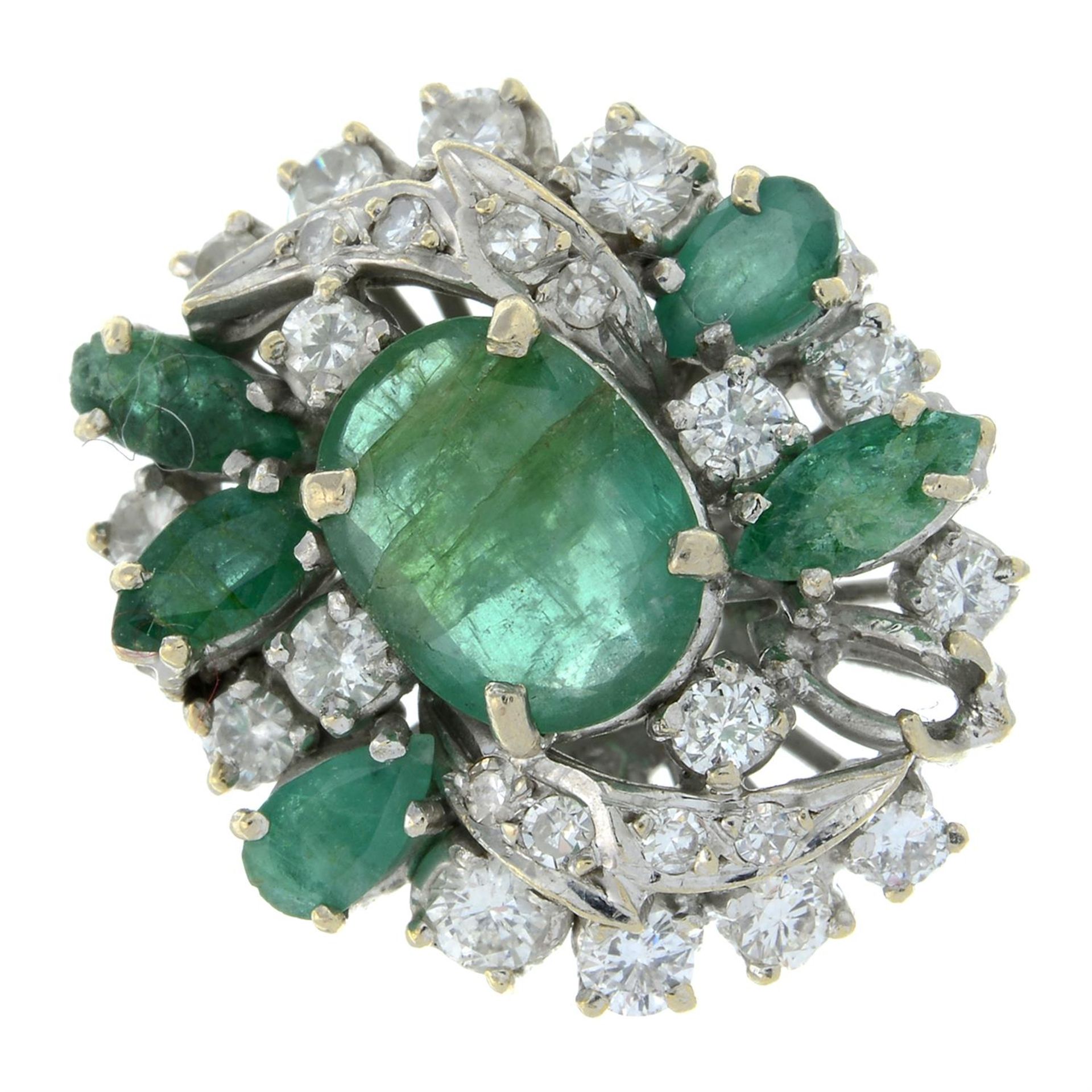 An emerald and brilliant-cut diamond dress ring.