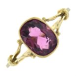 A late Victorian 15ct gold garnet single-stone ring, with openwork shoulders.