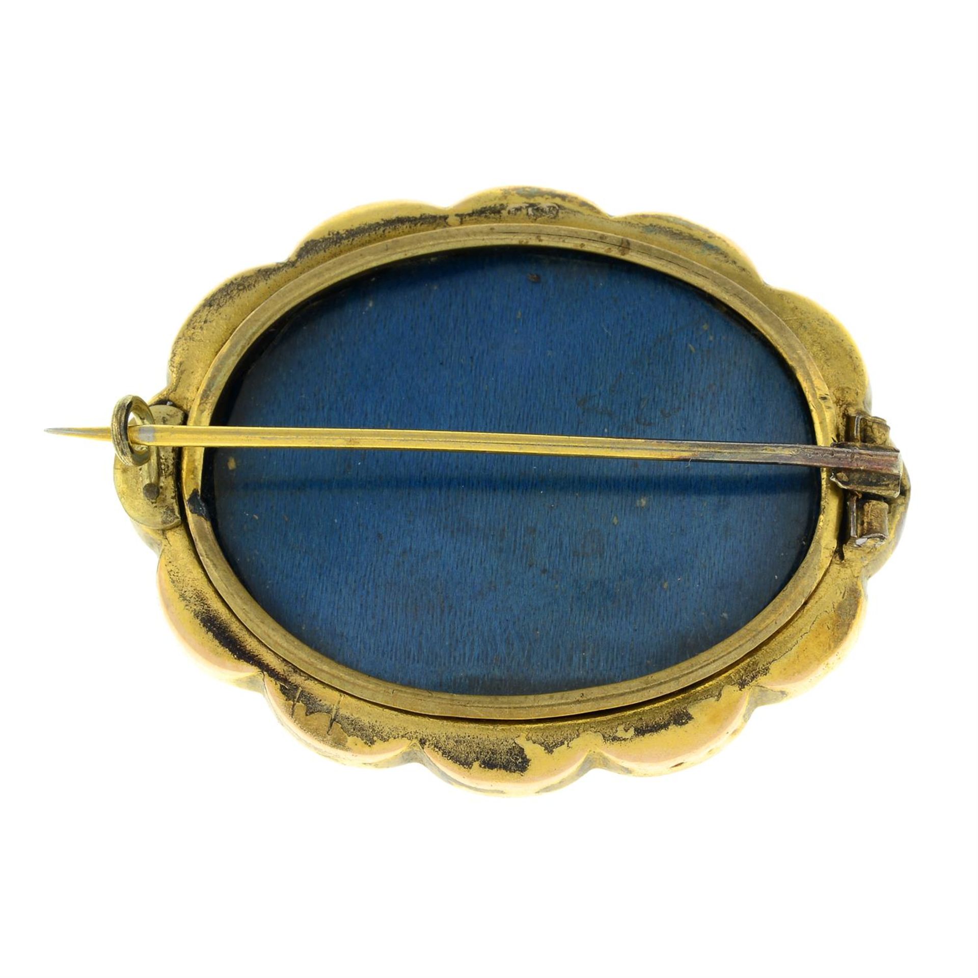 A late Victorian gold scalloped brooch, with glazed panel reverse. - Image 2 of 2