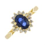 An 18ct gold sapphire and brilliant-cut diamond cluster ring.