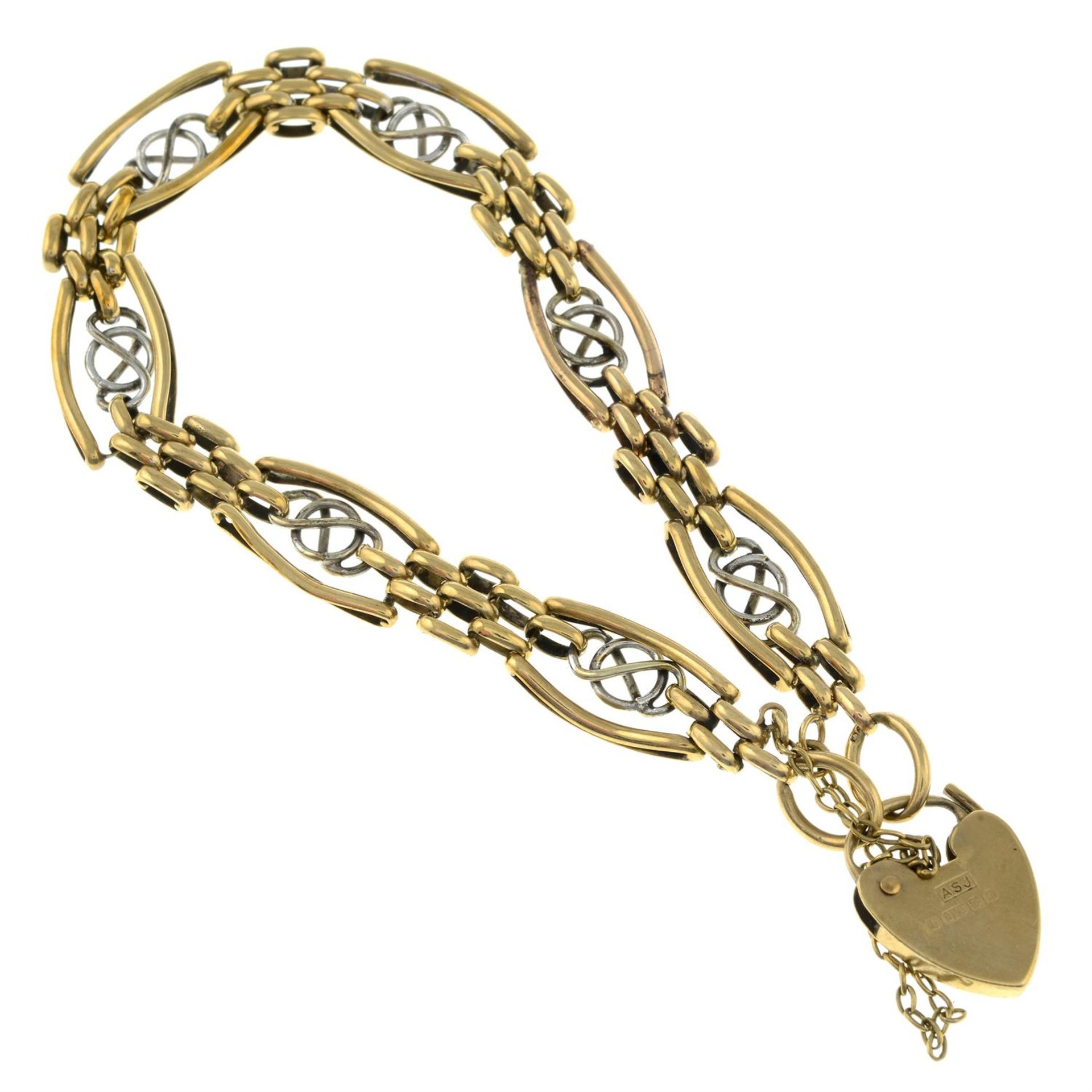 A 9ct bi-colour gold fancy-link charm bracelet, with heart-shaped padlock clasp. - Image 2 of 2