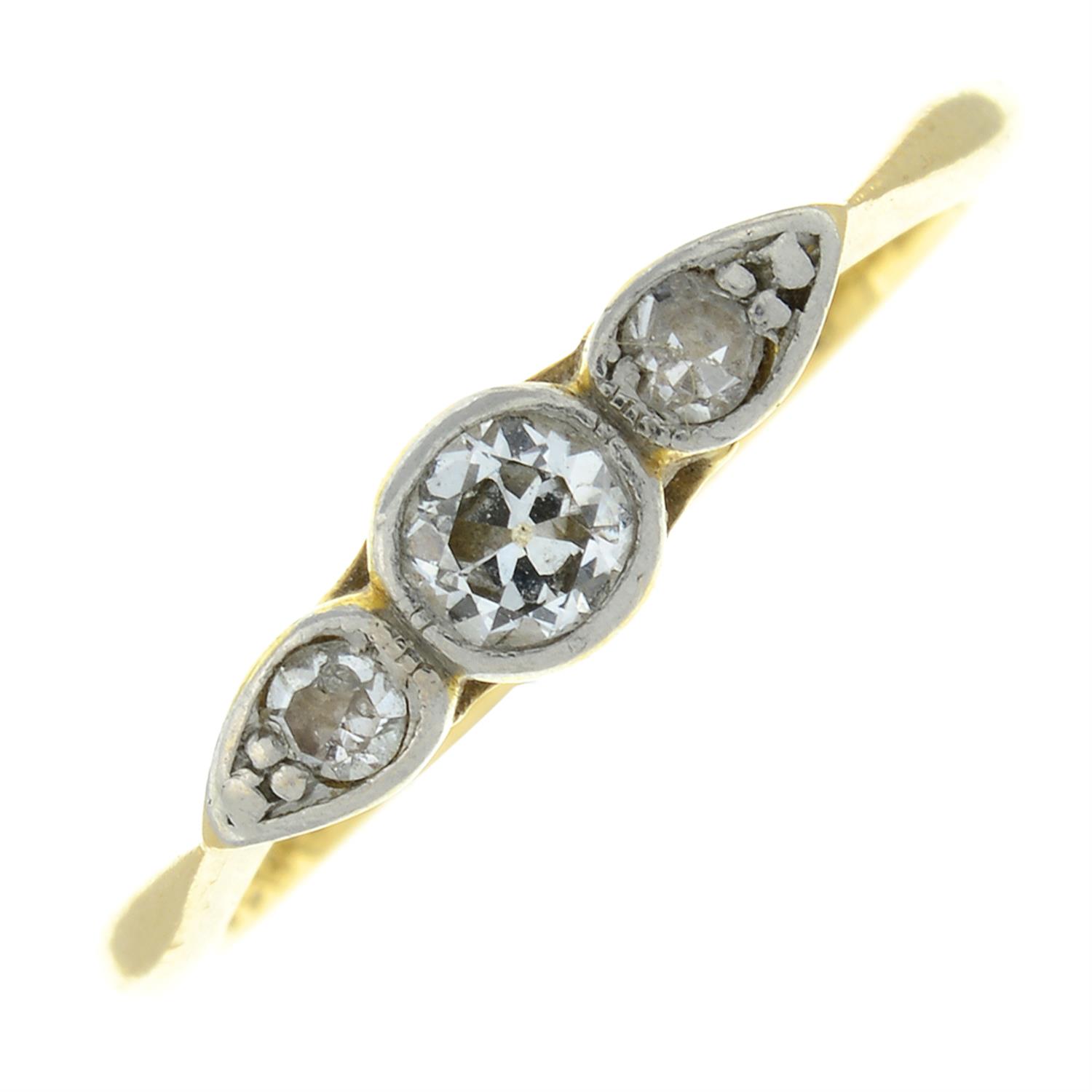 An early 20th century 18ct gold and platinum old-cut diamond three-stone ring.