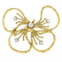 An 18ct gold brilliant-cut diamond abstract floral brooch, by John Donald.