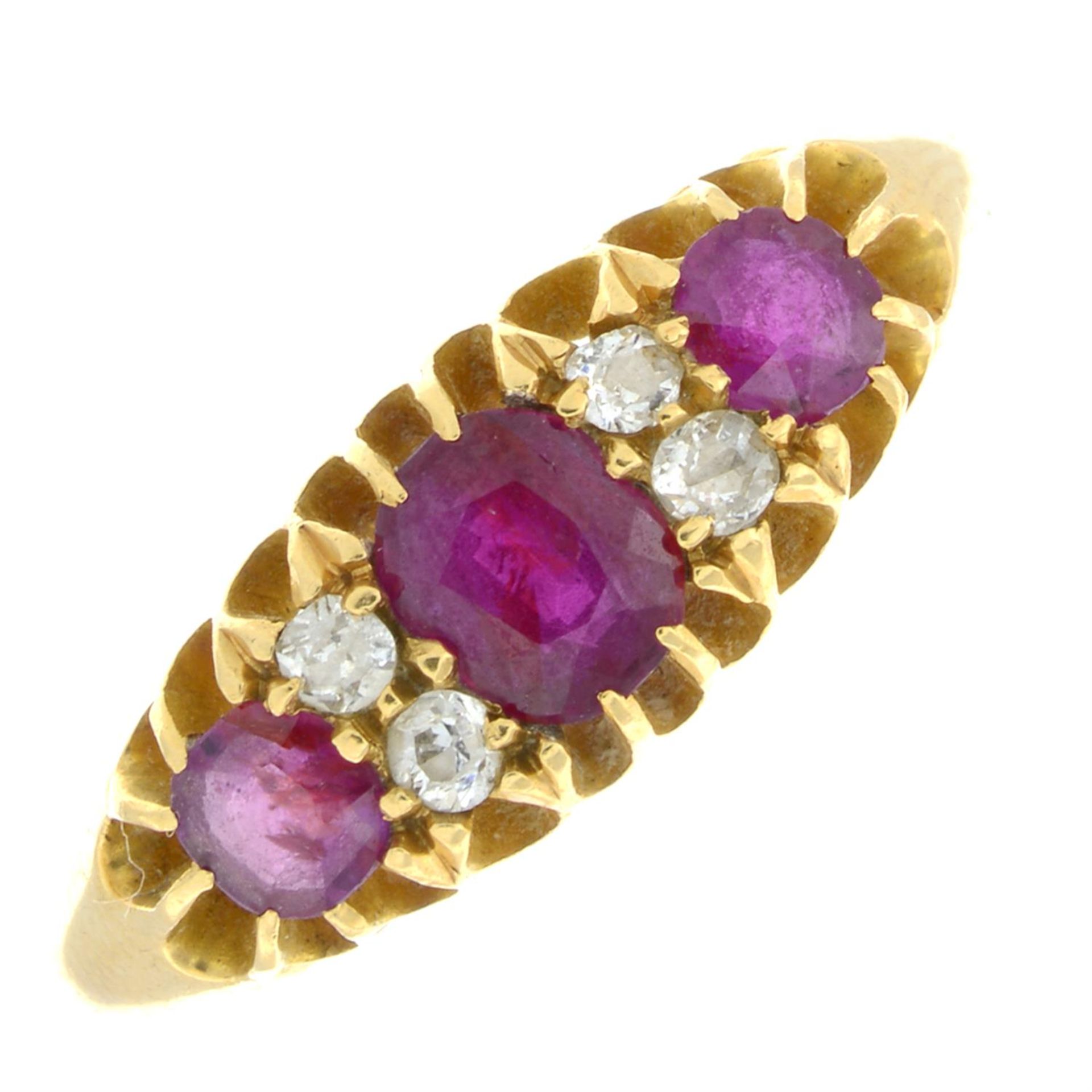 An Edwardian 18ct gold ruby three-stone ring, with old-cut diamond spacers.