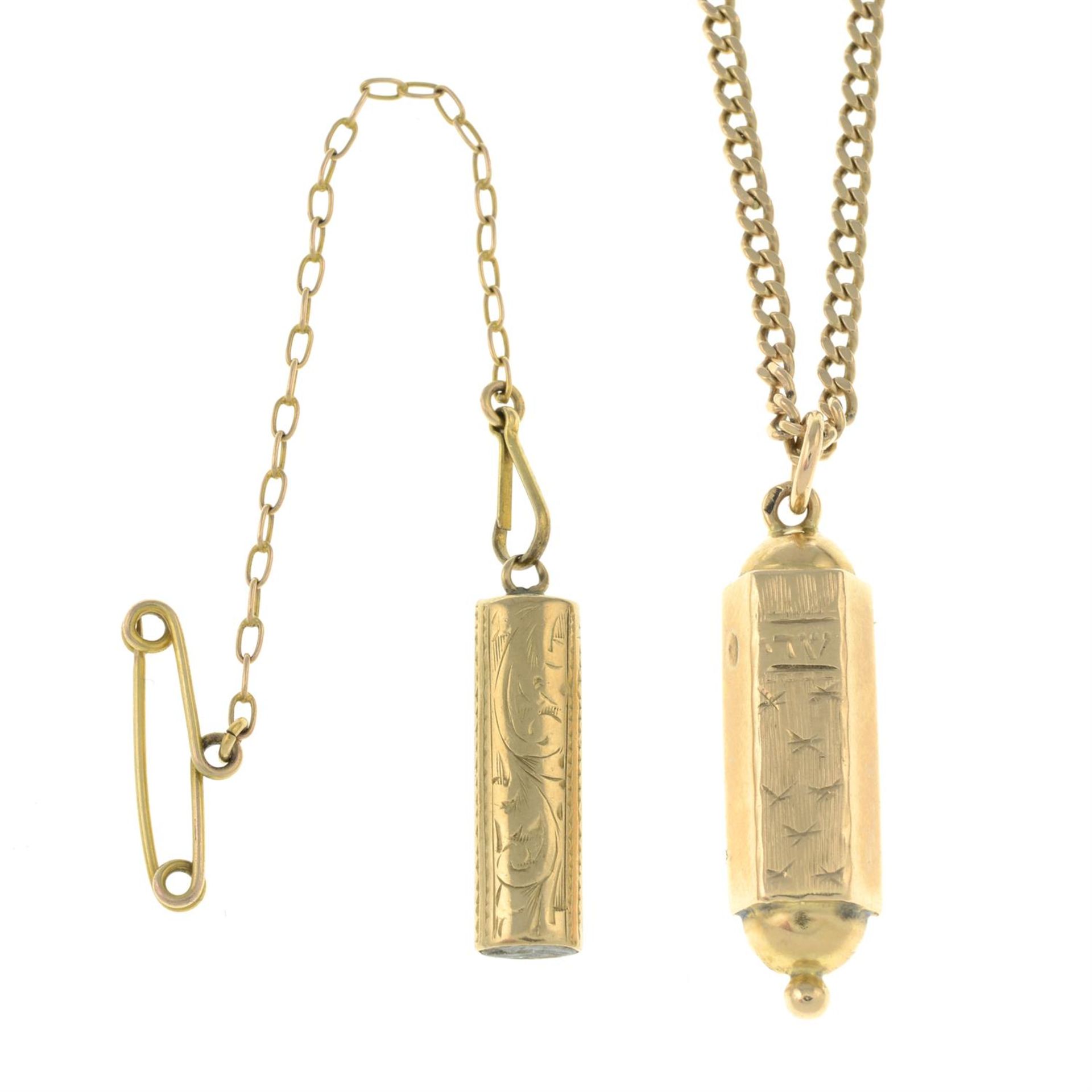 A torah charm, pendant and chain.