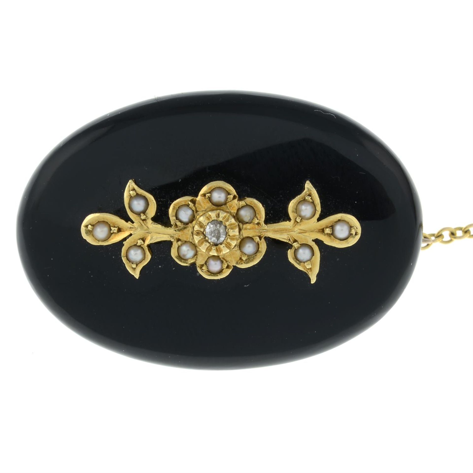A Victorian 18ct gold onyx, split pearl and old-cut diamond accent mourning locket brooch.