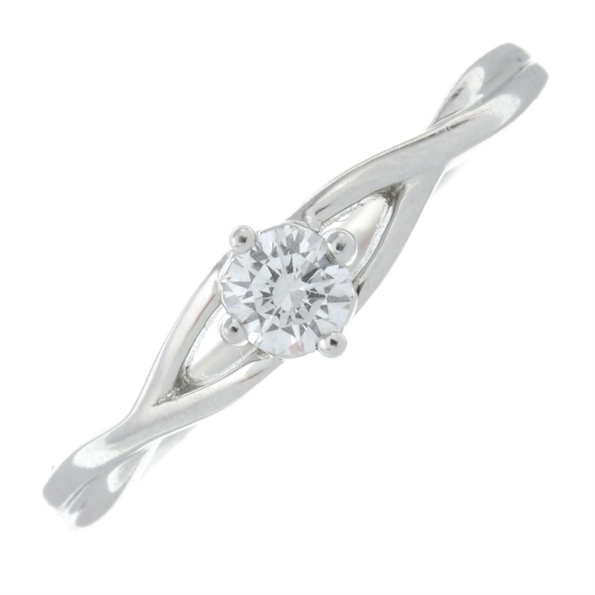 A 9ct gold brilliant-cut diamond ring, with crossover openwork shoulders.