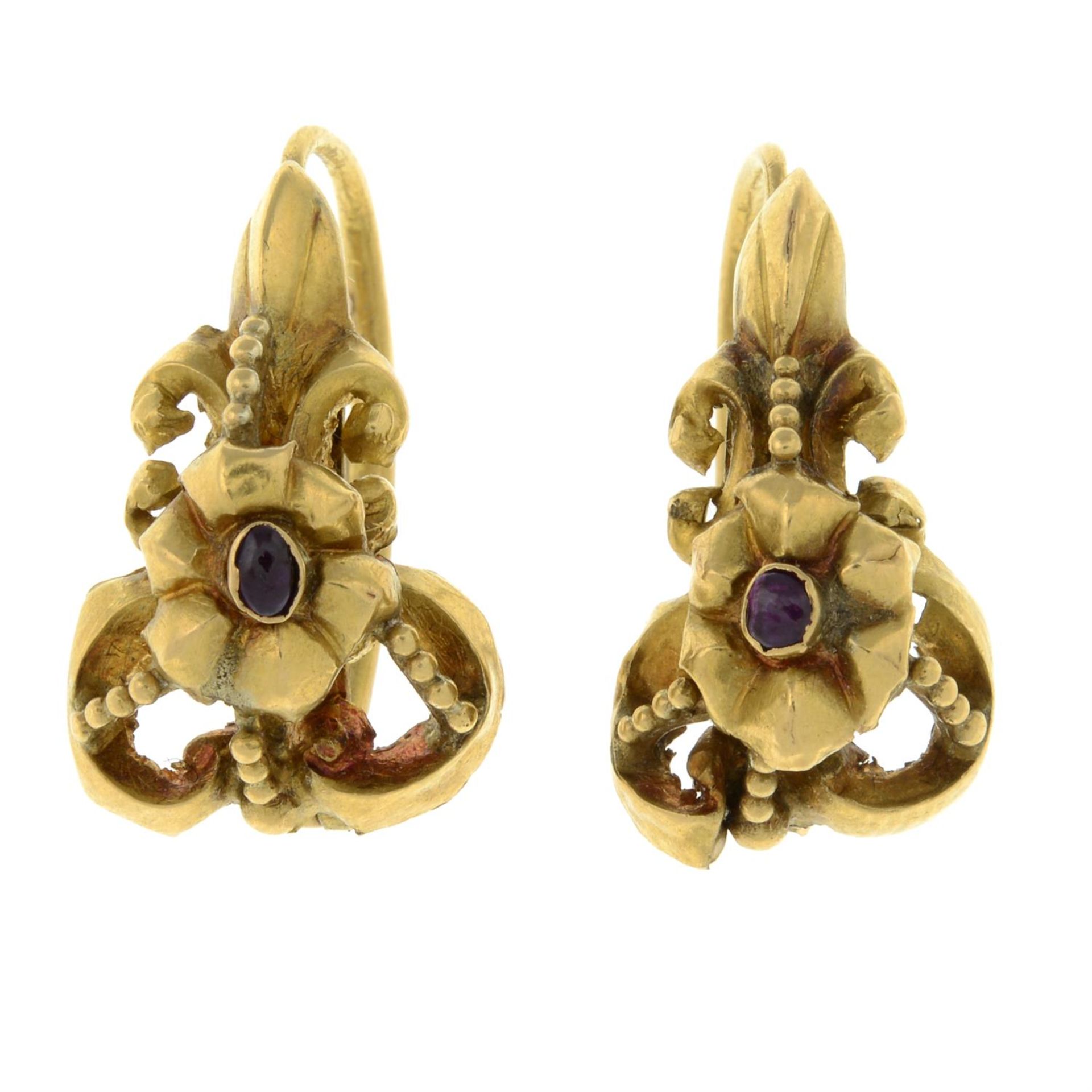 A pair of late 19th century gold cabochon ruby hinge-back earrings.