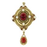 An imitation pearl and garnet pendant / brooch.