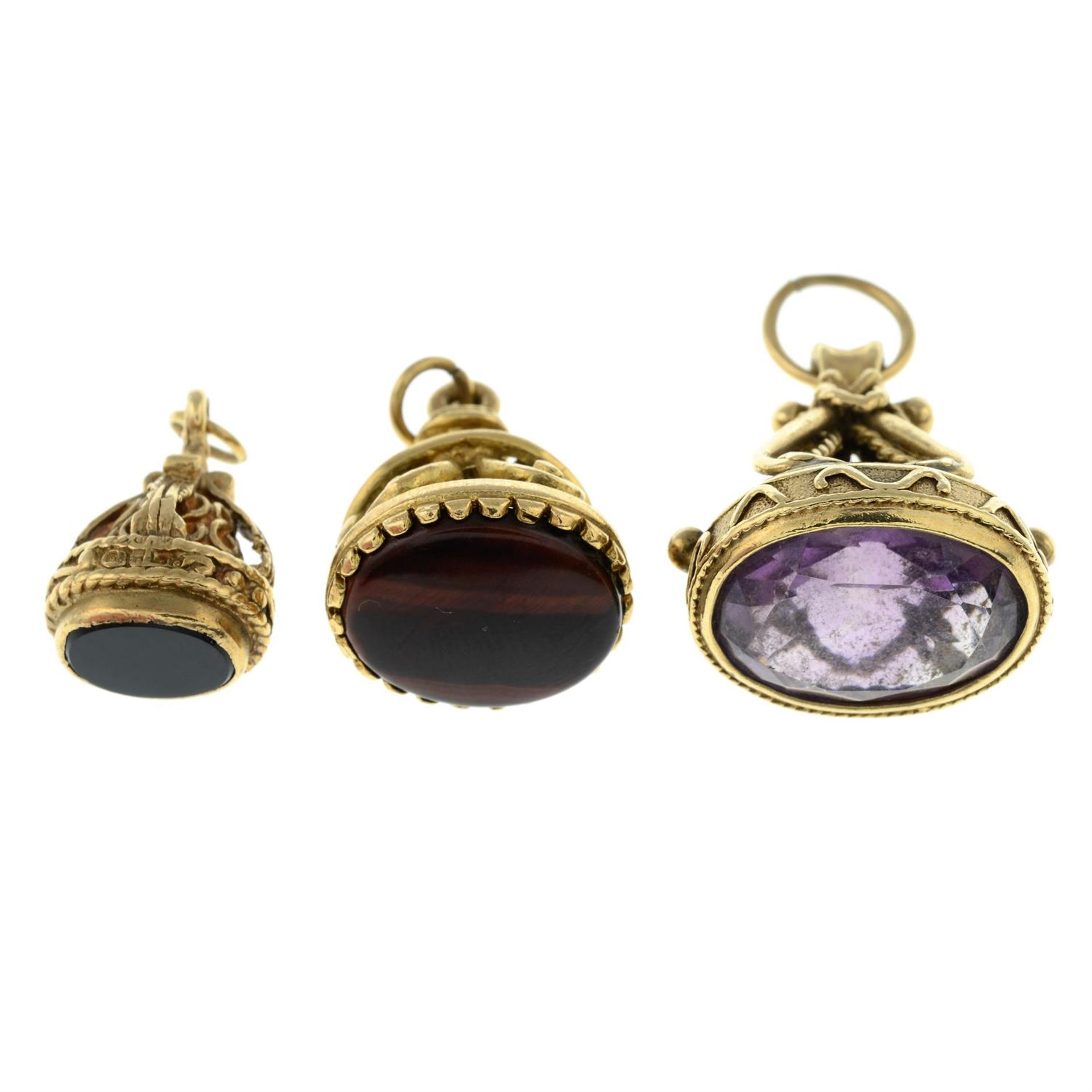 Three 9ct gold gem-set fob pendants.