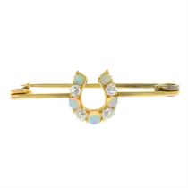 An Edwardian 9ct opal and old-cut diamond horseshoe brooch.