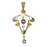 An Edwardian 9ct gold paste drop openwork pendant.