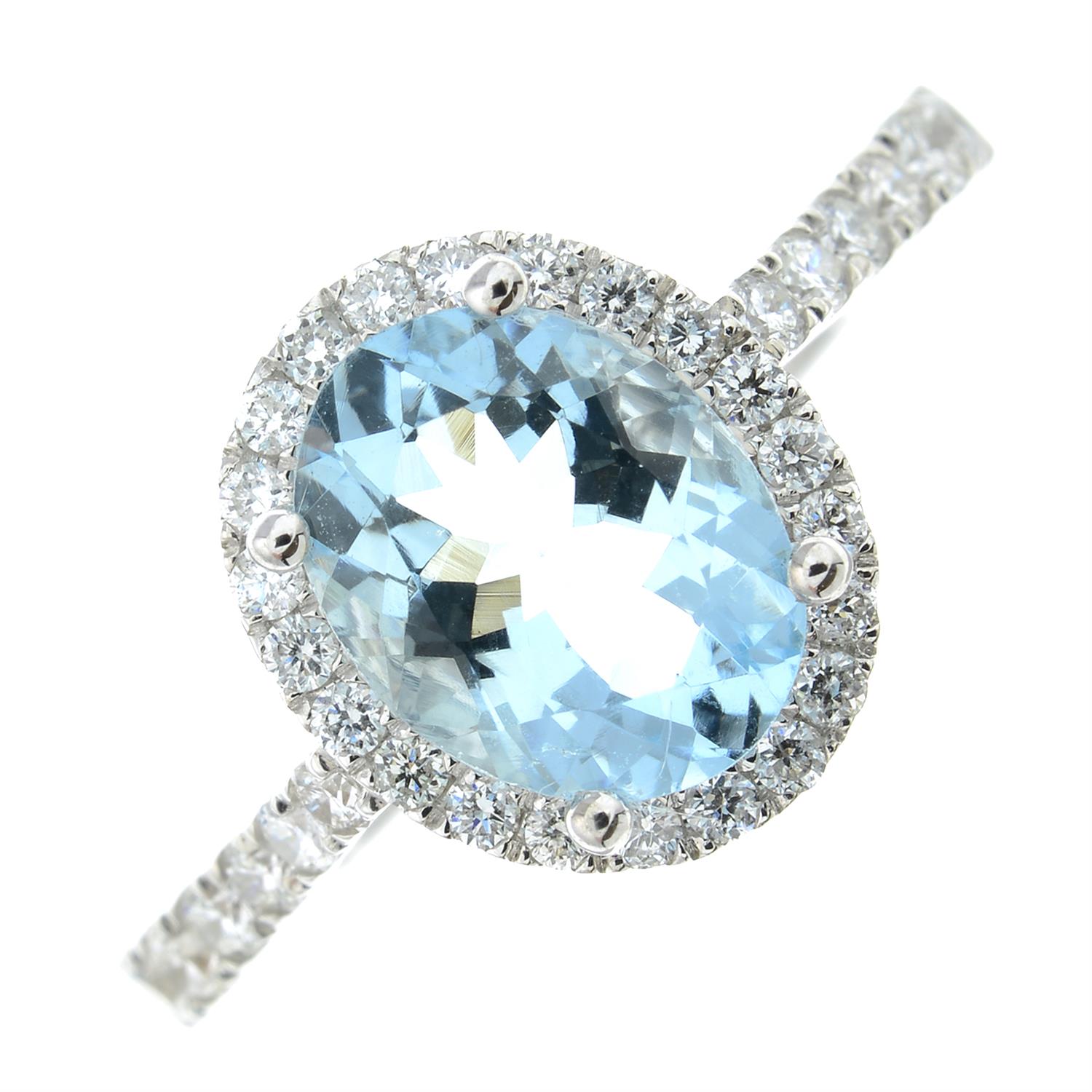 An 18ct gold aquamarine and brilliant-cut diamond cluster ring.