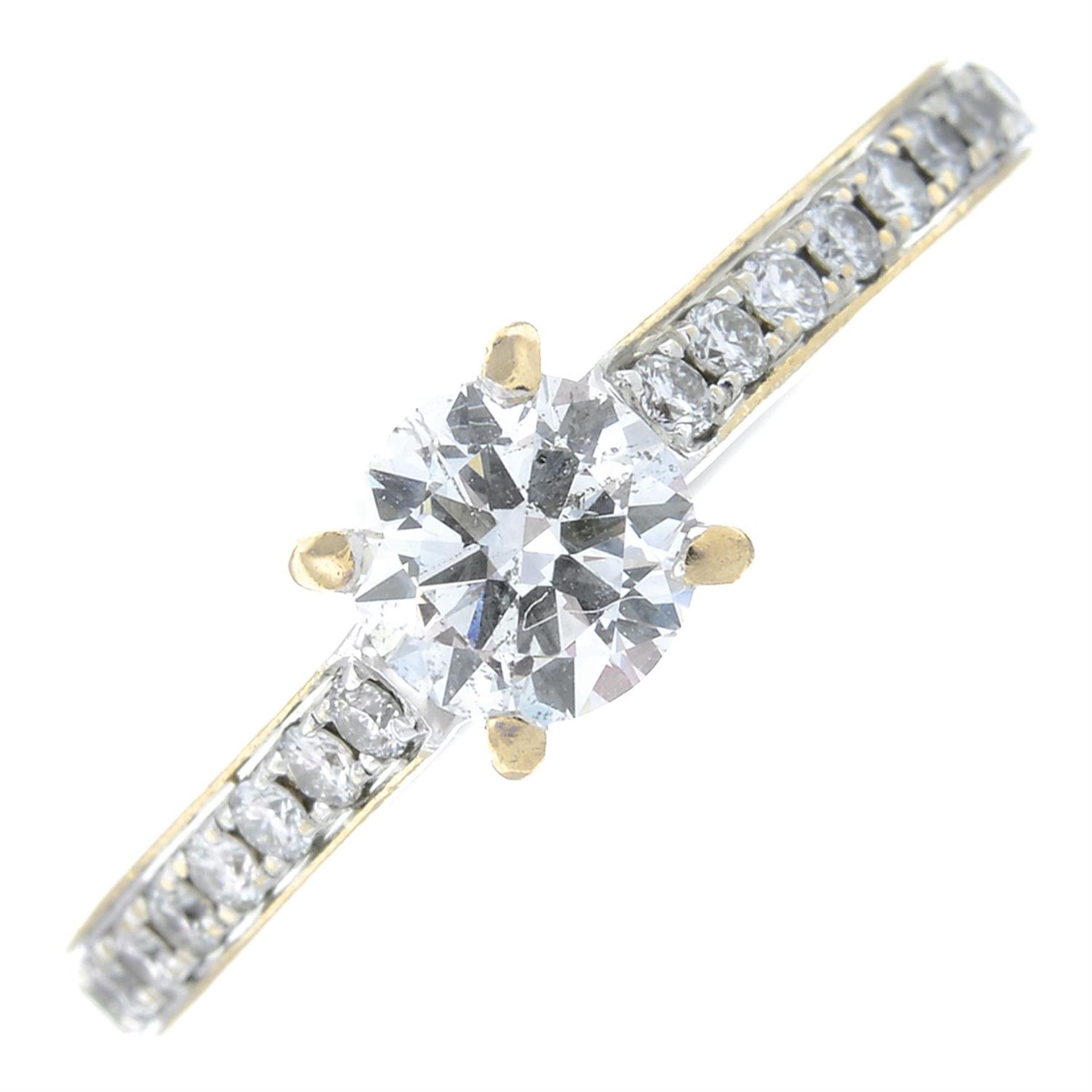 An 18ct gold brilliant-cut diamond single-stone ring, with pave-set diamond shoulders.