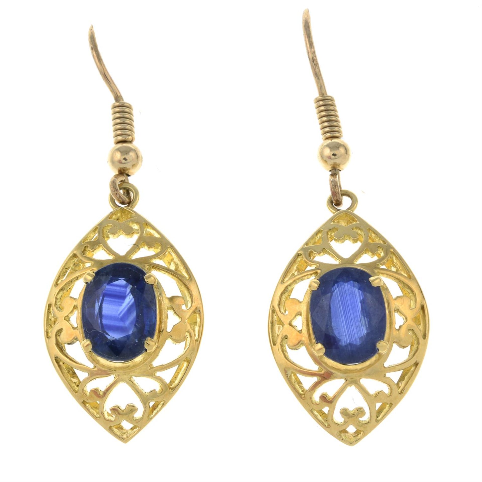 A pair of openwork earrings, with sapphire highlights.