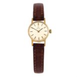 OMEGA - a 9ct yellow gold wrist watch, 18mm.