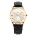 LONGINES - a yellow metal wrist watch, 34mm.