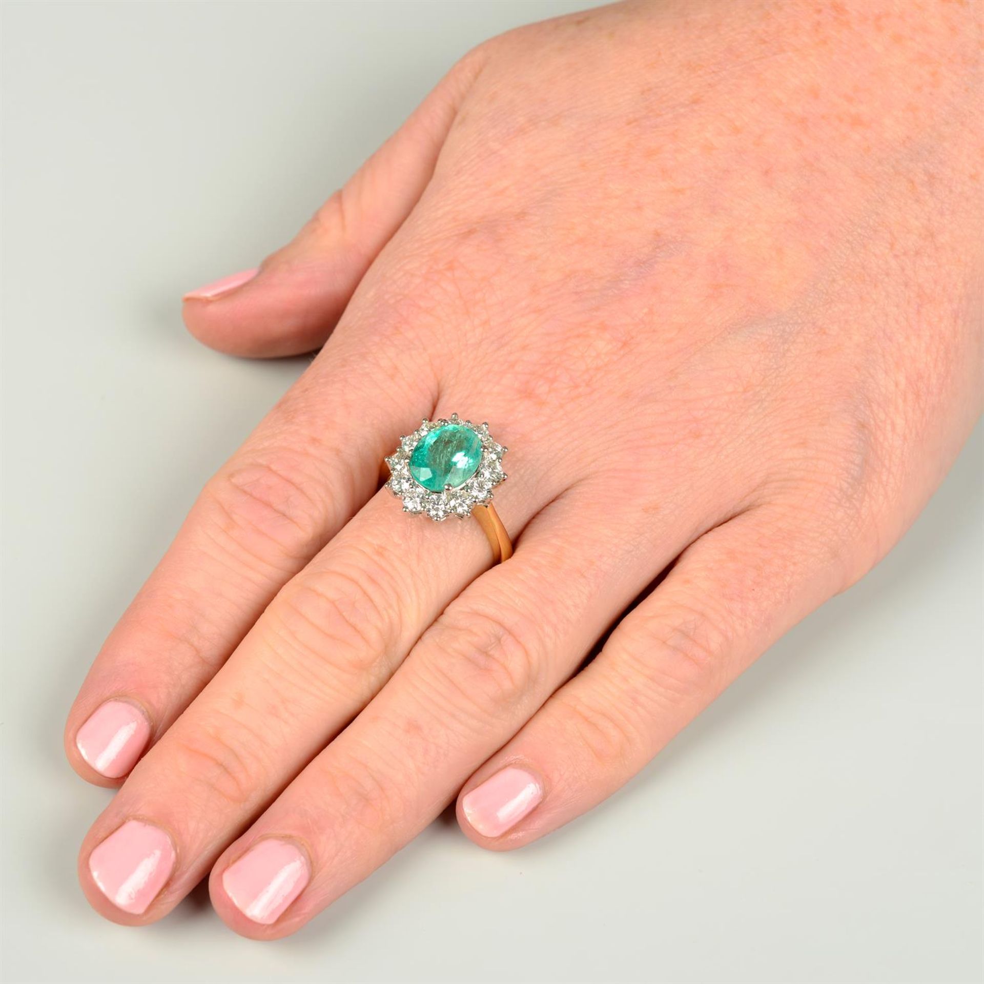 An 18ct gold emerald and brilliant-cut diamond cluster ring. - Image 5 of 5