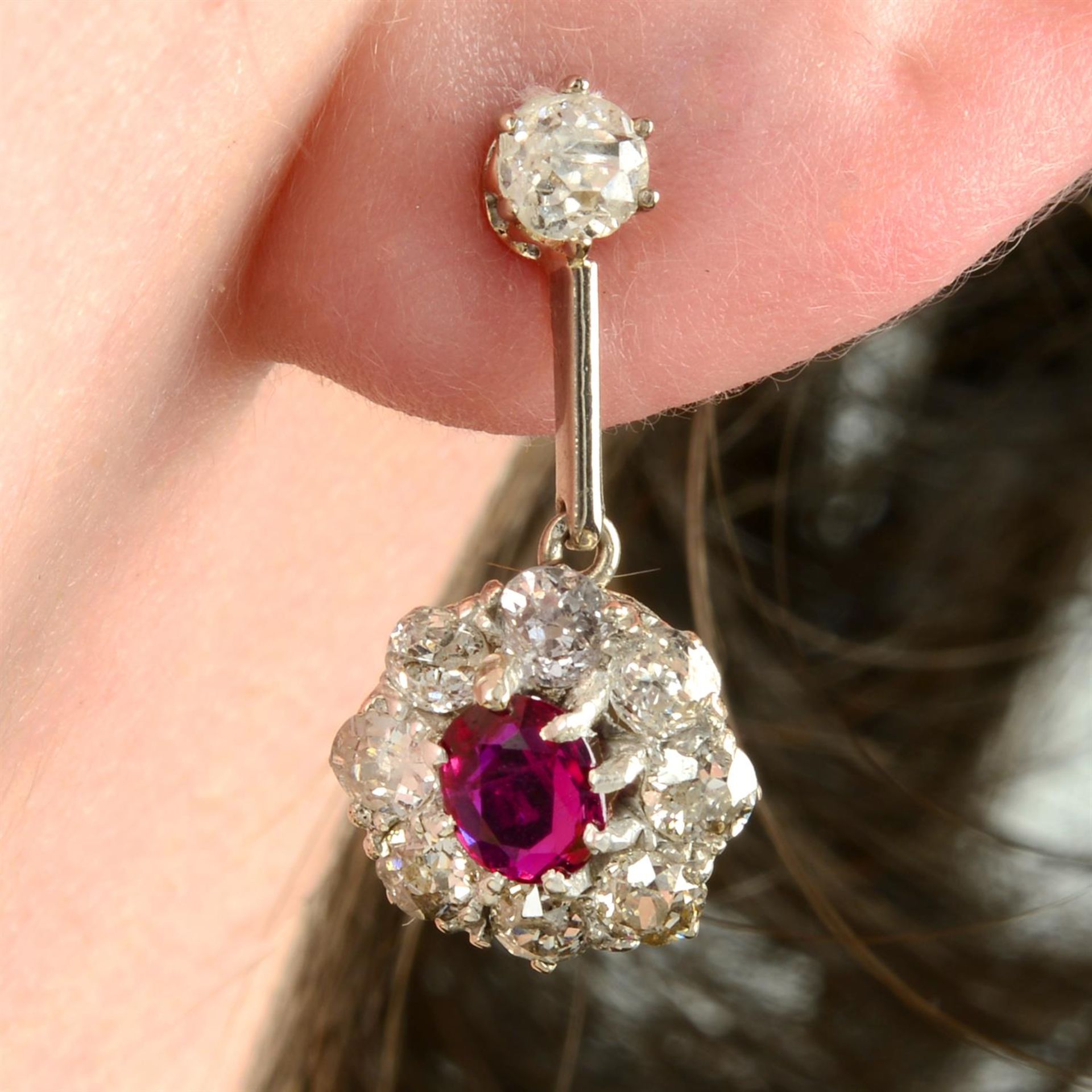 A pair of ruby and old-cut diamond floral cluster earrings.
