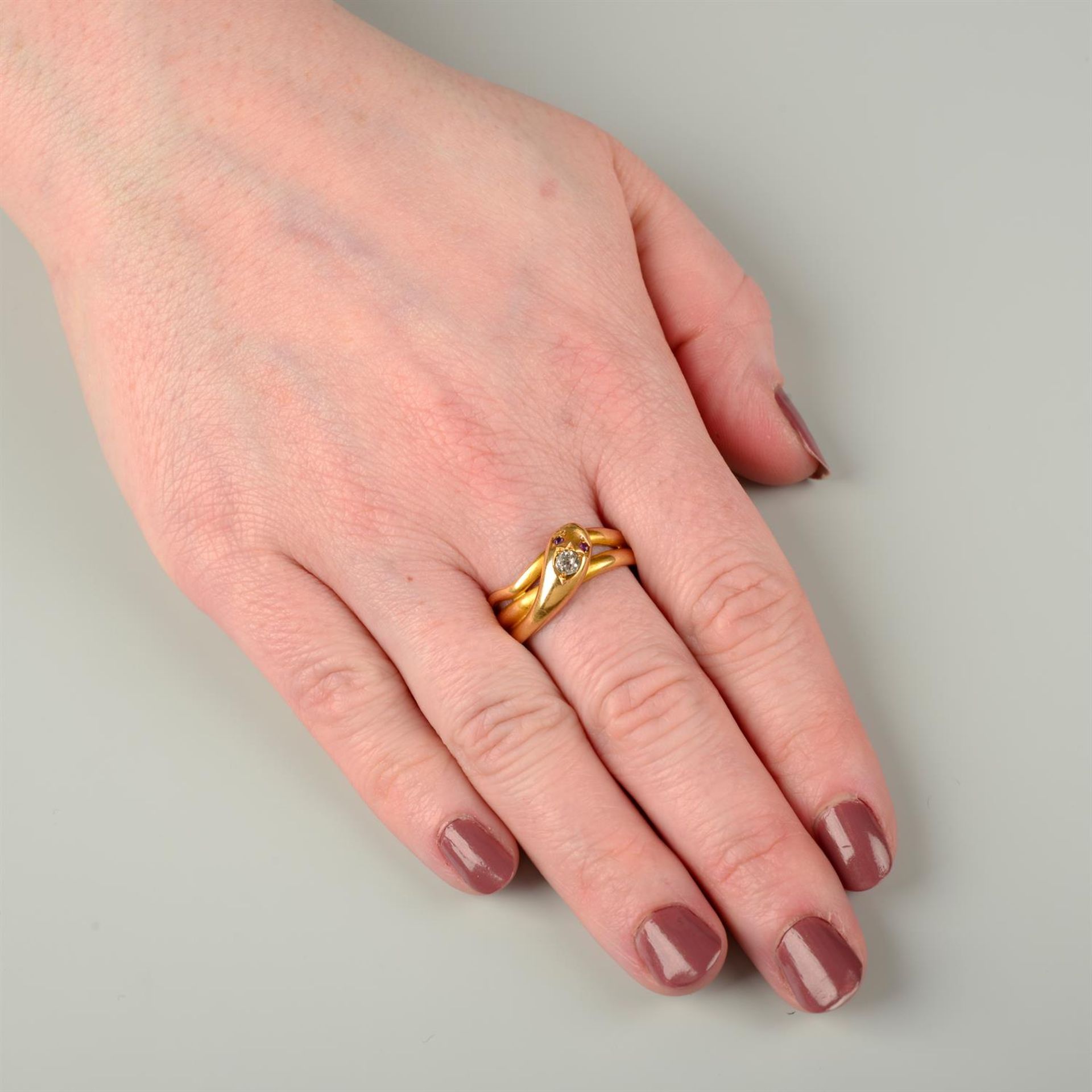 A late Victorian 18ct gold snake ring, with old-cut diamond crest and ruby eyes. - Bild 4 aus 4