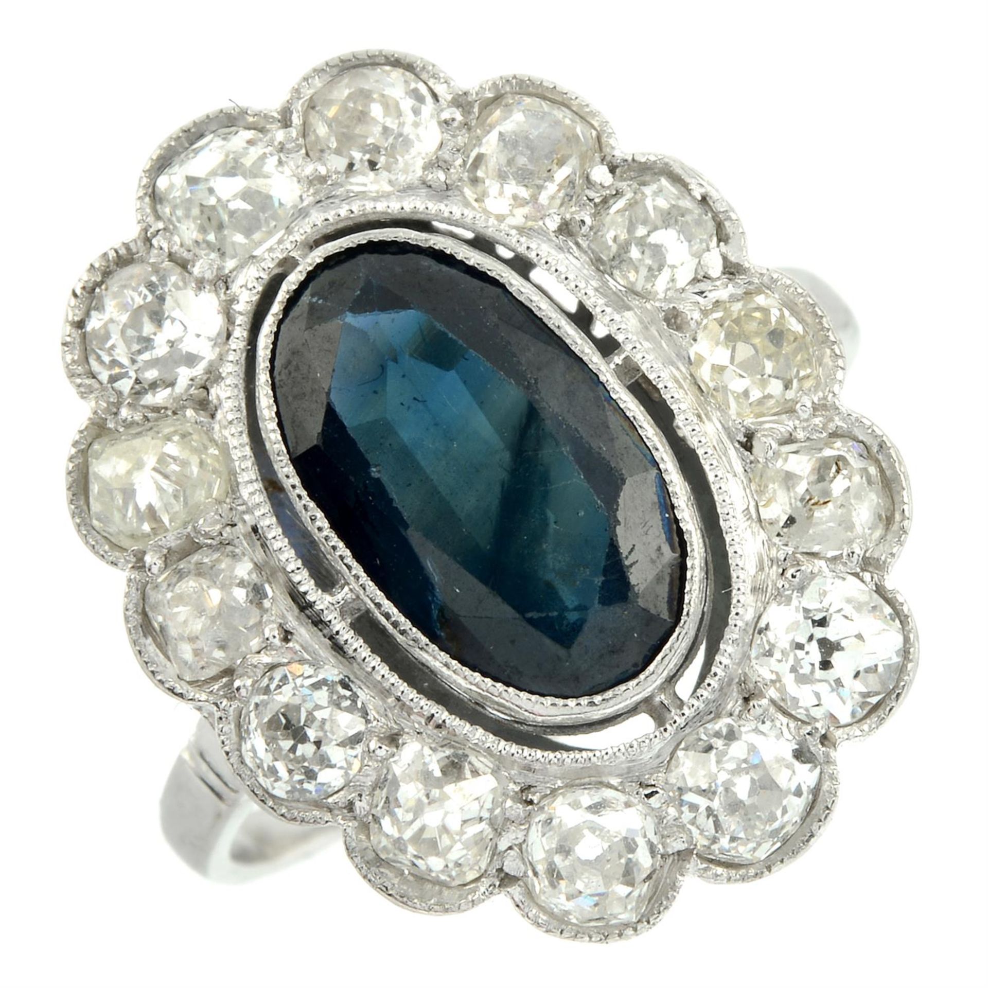 A mid 20th century platinum sapphire and old-cut diamond cluster ring. - Image 2 of 5