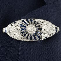 A sapphire and brilliant-cut diamond pierced geometric brooch.