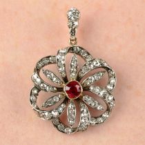 A late Victorian silver and gold, ruby and diamond floral cluster pendant.
