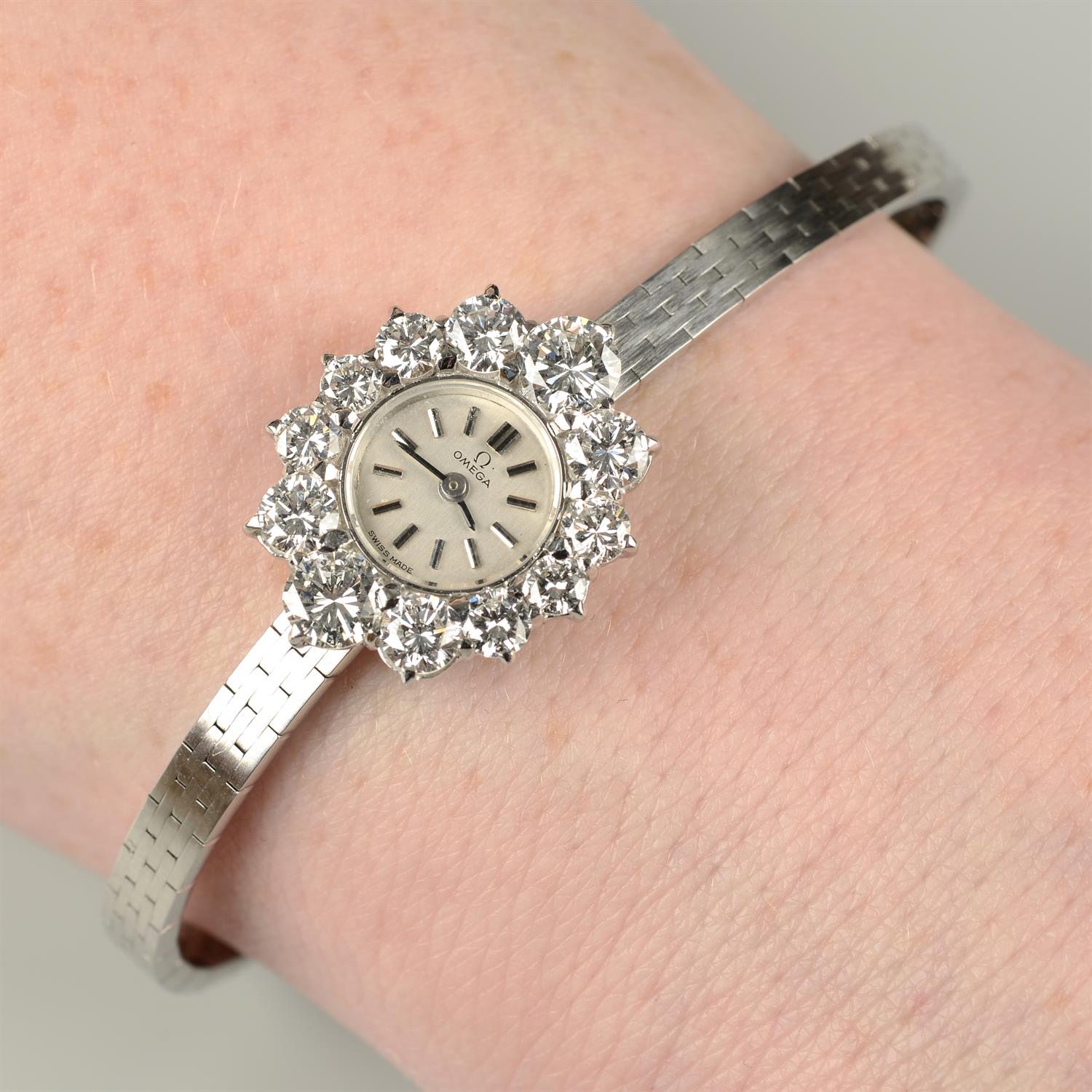 A lady's mid 20th century 18ct gold wristwatch, with graduated brilliant-cut diamond bezel,