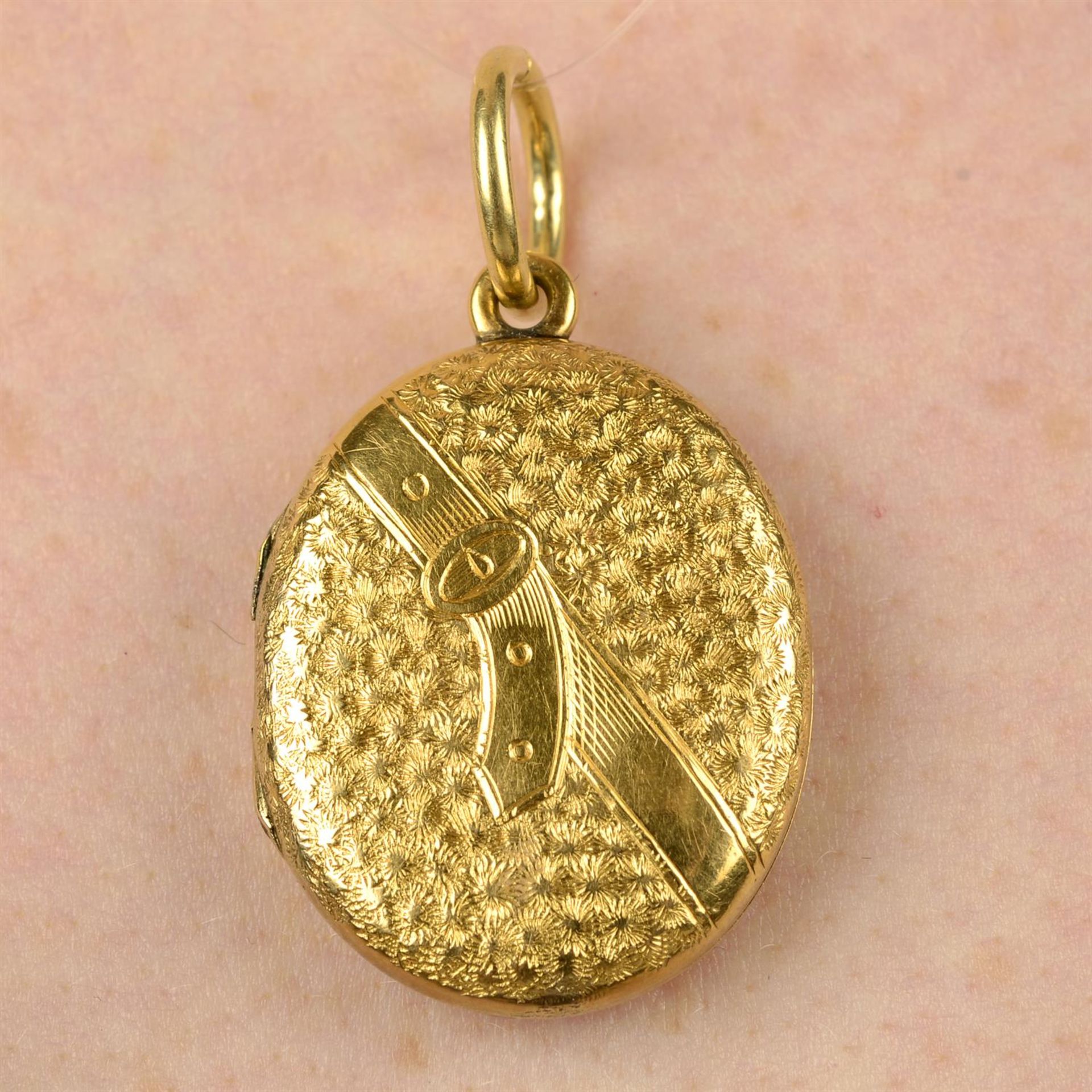 A late Victorian gold foliate and belt motif locket.